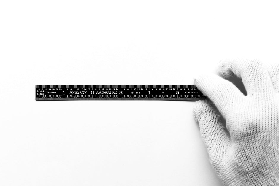 Multi-angle Measuring Set ruler being held in a gloved hand, showcasing precise measurement capabilities.