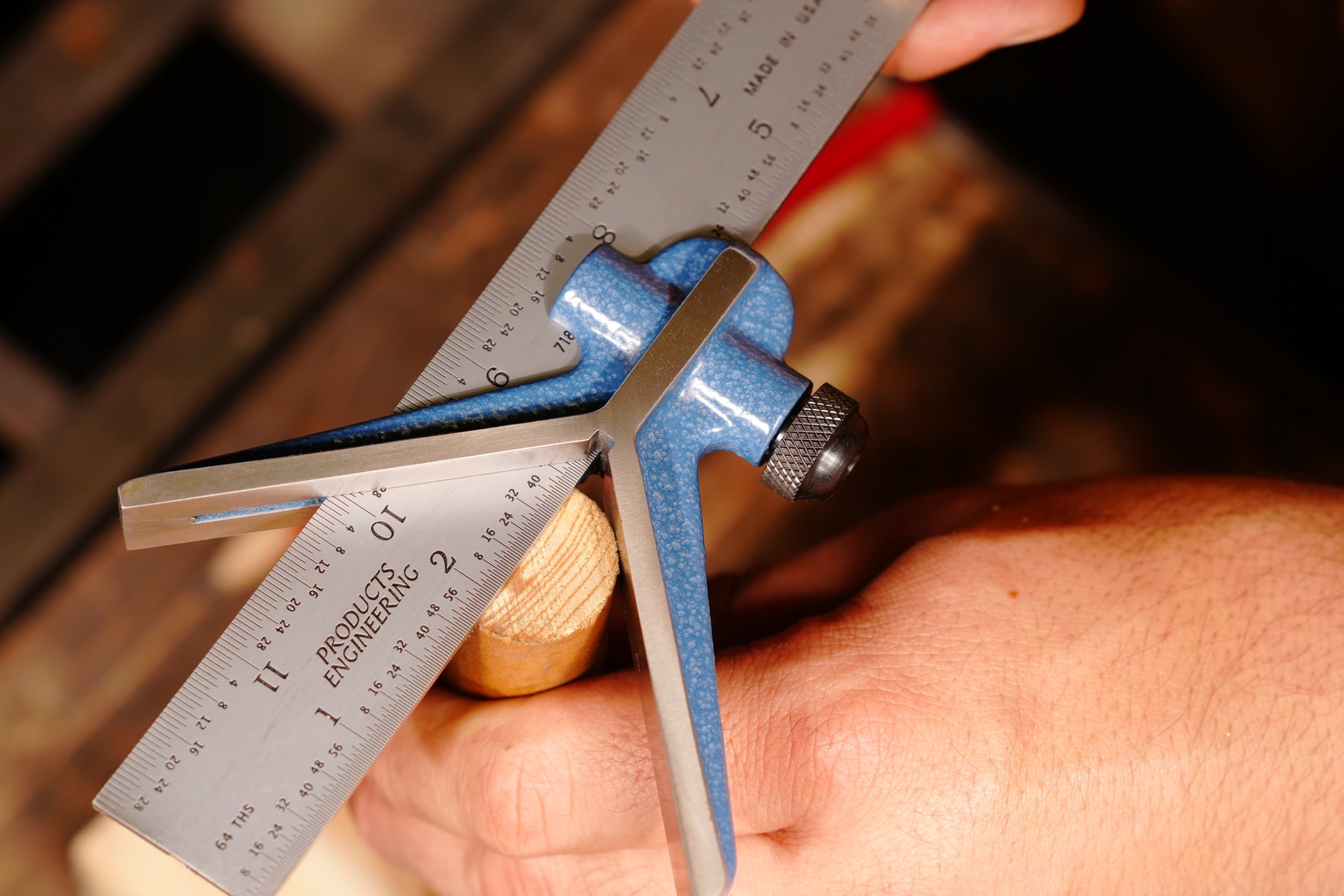 Center Head for Combination Square in use, highlighting precise measurement on a wooden workpiece.