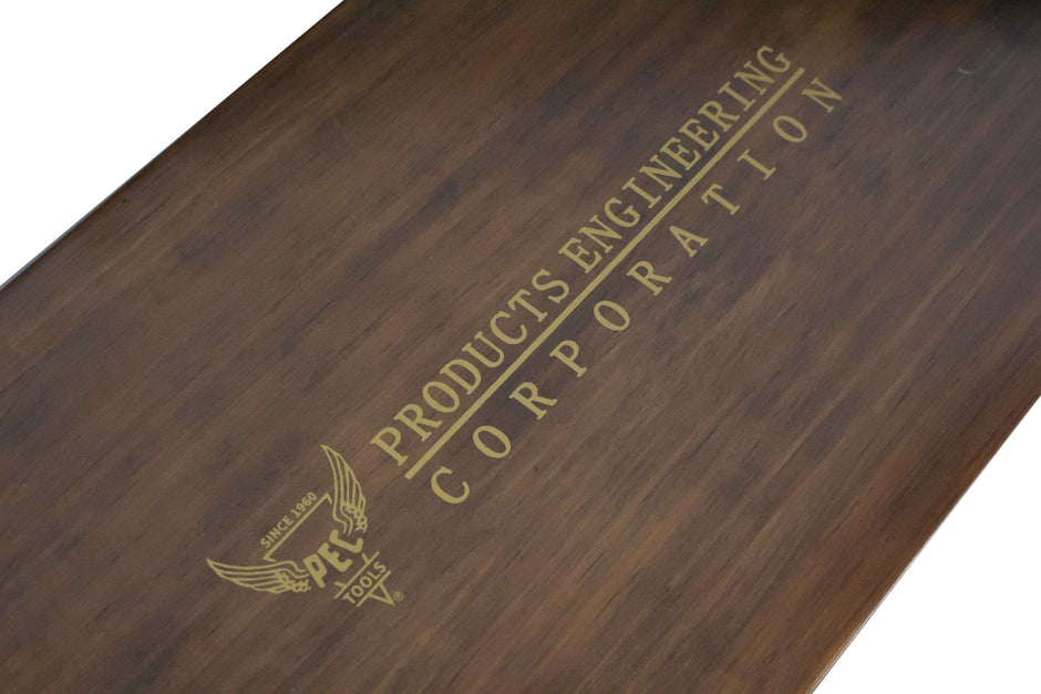 Wooden storage case for combination square sets by PEC Tools featuring a logo printed on the top surface.